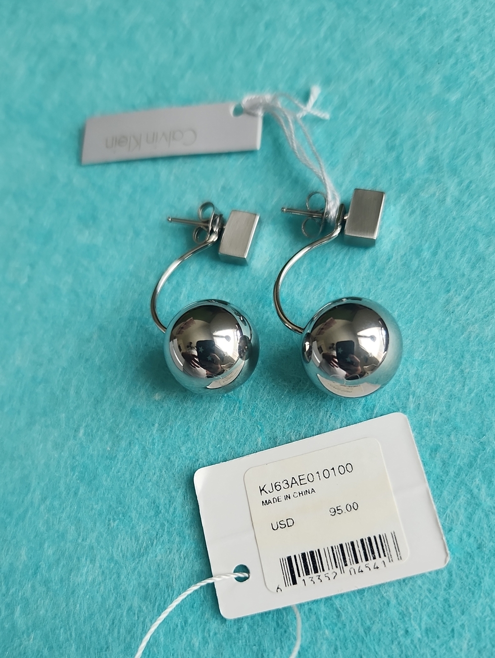 Calvin Klein Polished Silver Sphere Drop Earrings.